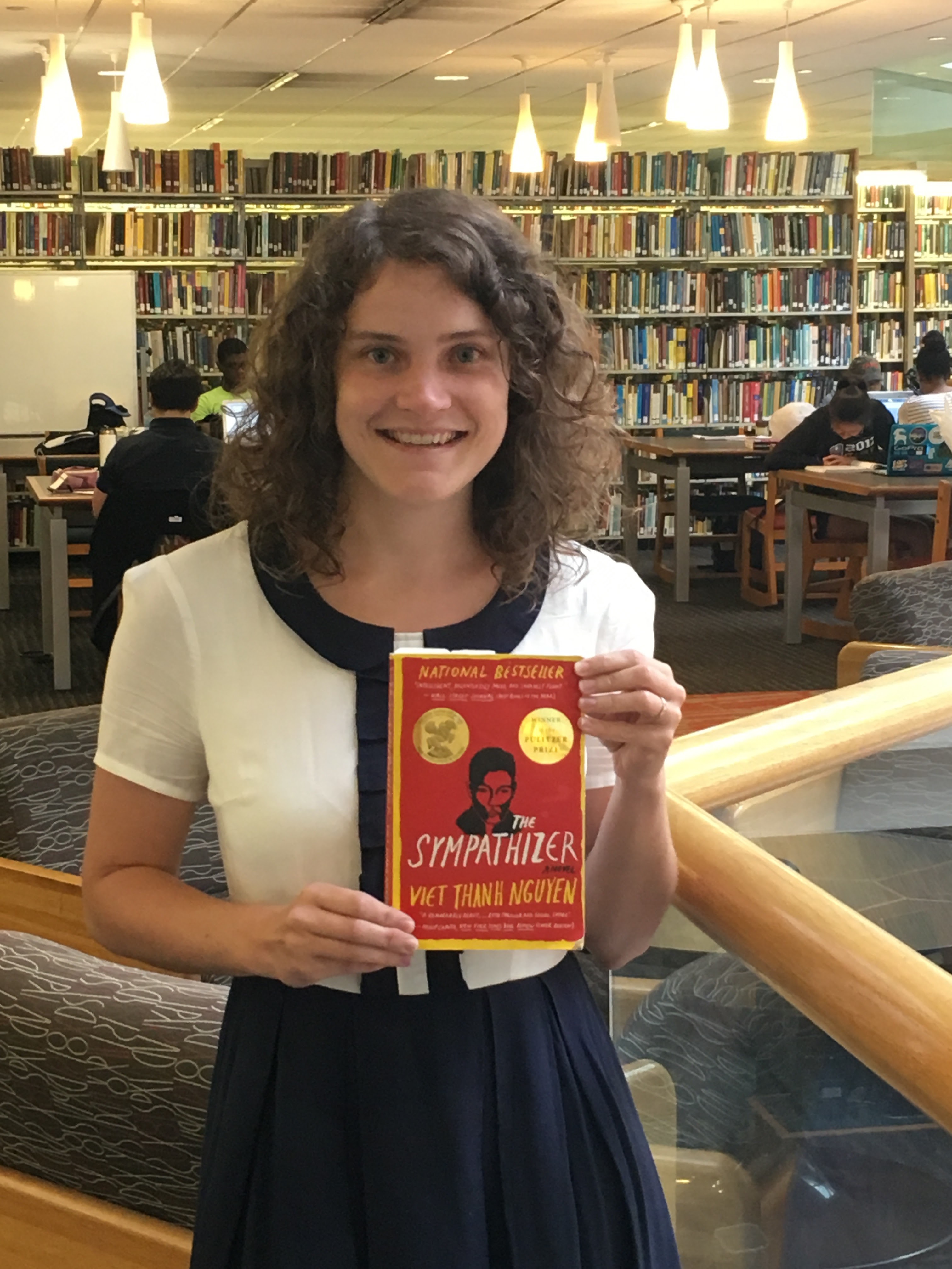 Sarah Rich holds a copy of the book 'The Sympathizer' by Viet Thanh Nguyen